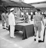 In September 1945, 20,000 British troops of the 20th Indian Division occupied Saigon under the command of General Sir Douglas David Gracey. During the Potsdam Conference in July 1945, the Allies had agreed on Britain taking control of Vietnam south of the 16th parallel (then part of French Indochina) from the Japanese occupiers. Meanwhile, Ho Chi Minh proclaimed Vietnamese independence from French rule and major pro-independence and anti-French demonstrations were held in Saigon. Ho Chi Minh was the leader of the communist Viet Minh.<br/><br/>

The French, anxious to retain their colony, persuaded Gracey's Commander in Chief, Lord Mountbatten, to authorise Gracey to declare martial law. Fearing a communist takeover of Vietnam, Gracey decided to rearm French citizens who had remained in Saigon. He allowed them to seize control of public buildings from the Viet Minh. In October 1945, as fighting spread throughout the city, Gracey issued guns to the Japanese troops who had surrendered. He used them to help maintain colonial rule.<br/><br/>

According to some socialist and communist commentaries, this controversial decision furthered Ho Ch Minh's cause of liberating Vietnam from foreigners' rule and precipitated the First Indochina War. French General Leclerc arrived in Saigon in October 1945 to assume authority but it was not until well into the first half of 1946 that enough French troops had arrived to allow General Gracey to return with his troops to India where the 20th Indian Division was disbanded.